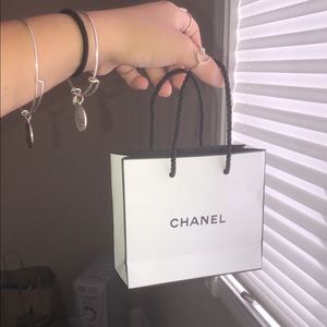 little chanel bag with goodies inside
